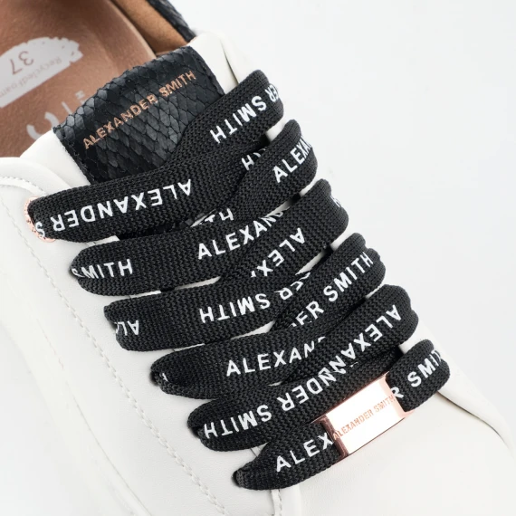 Sneakers vegana bianca con sperone e linguella in stampato pitone nero