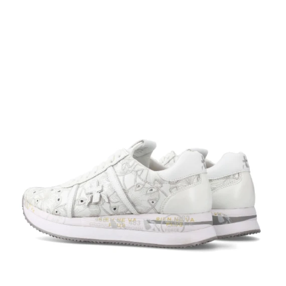 Sneakers Conny in pelle bianca laserata con ricami fiorati in tono